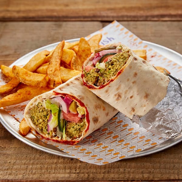 Two Manakish falafel wraps with fresh vegetables and fries on a metal plate.